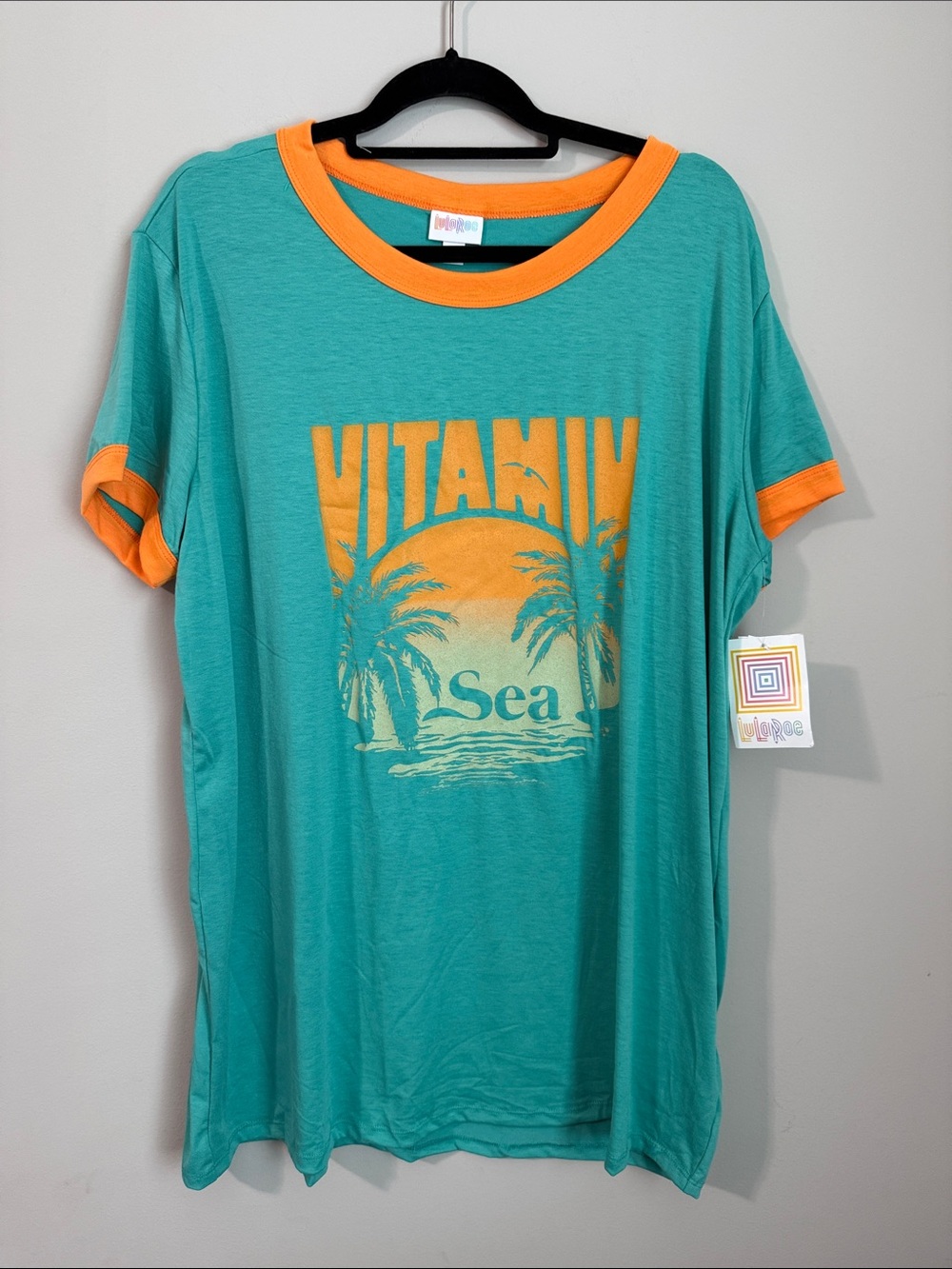 LuLaRoe Teal Tee with Orange Trim & Palm Graphic